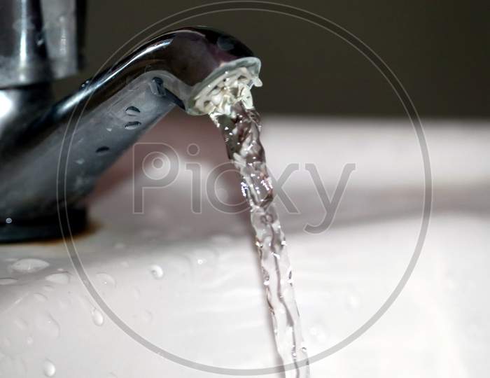 Tap Water Flow In Washbasin