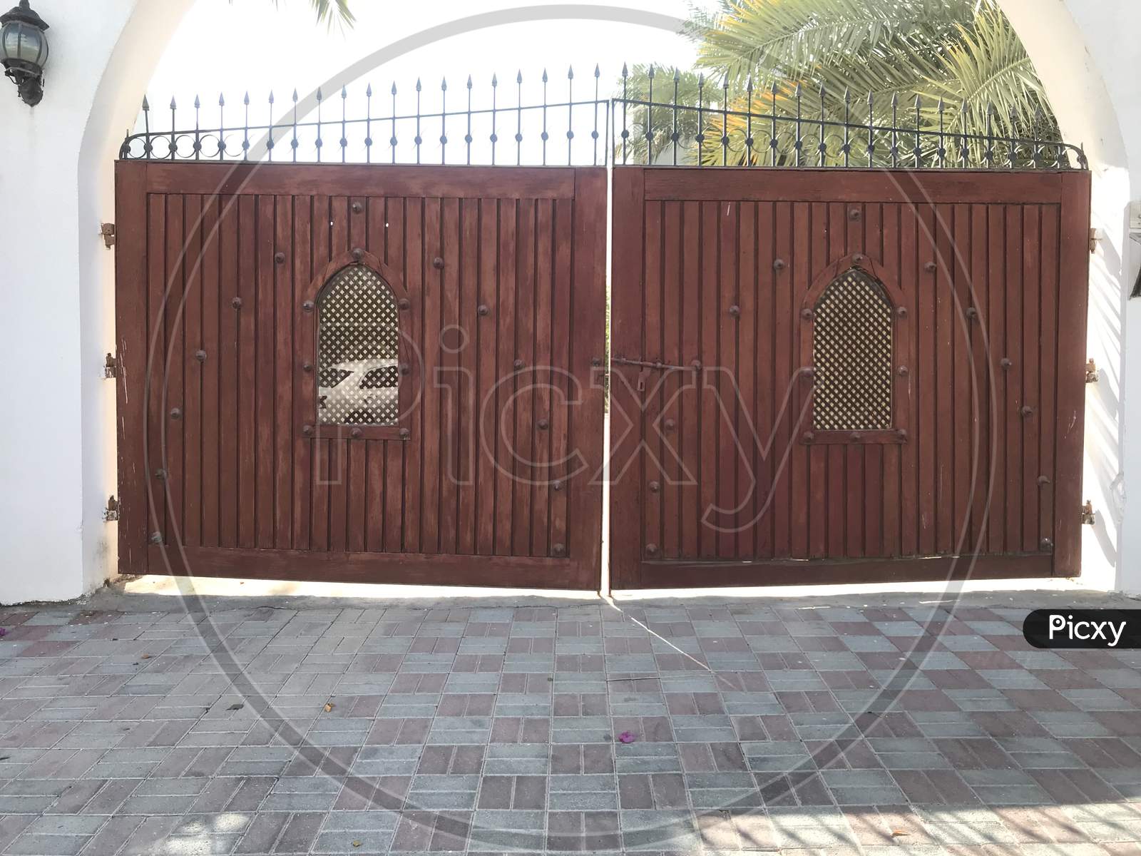 Wooden Shutter With Steel Framed Gate For An Big Villa And Two Openings For Identification Of Personnel