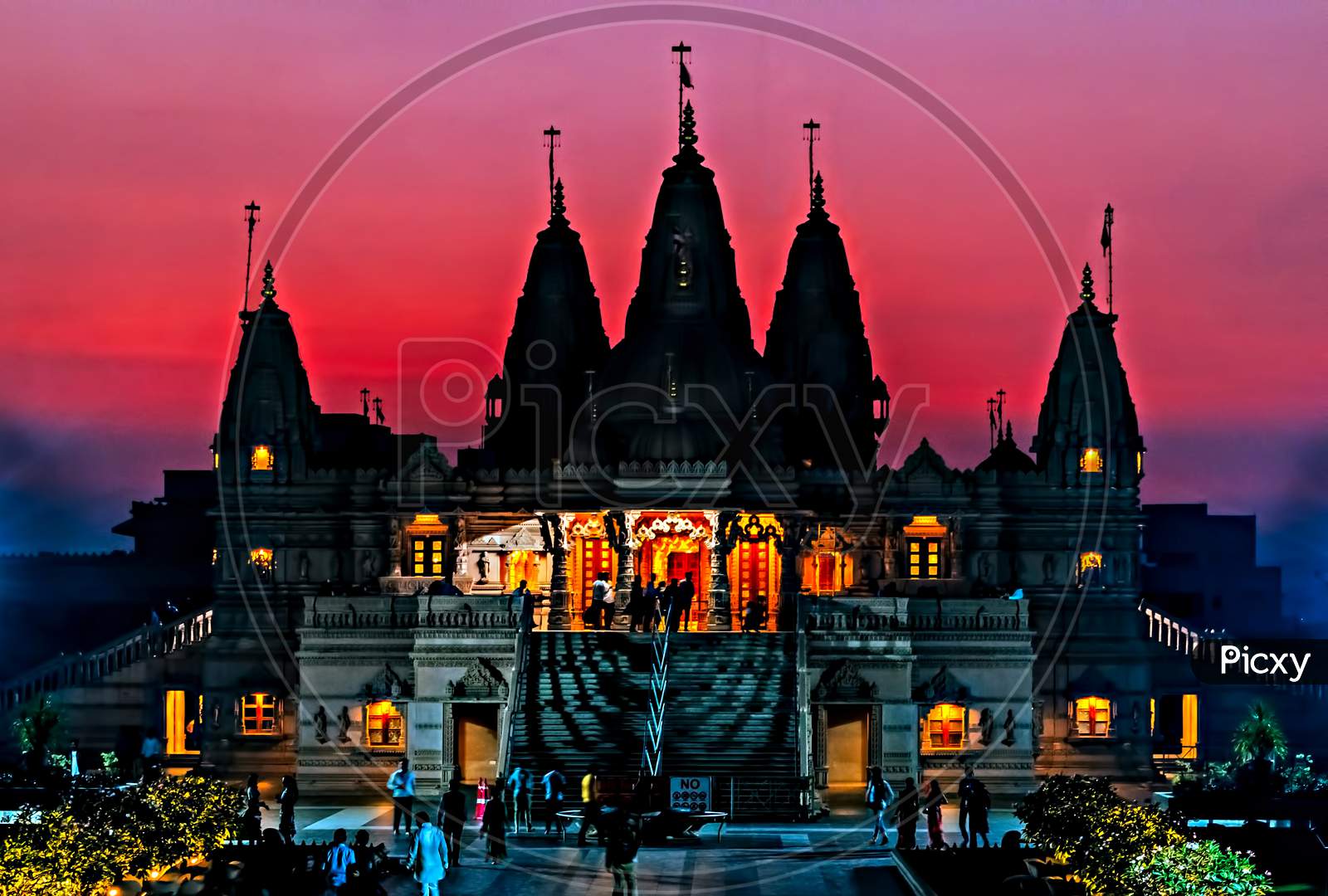 Silhoutte Image Of Shree Swaminarayan Temple On Orange Sky Backg