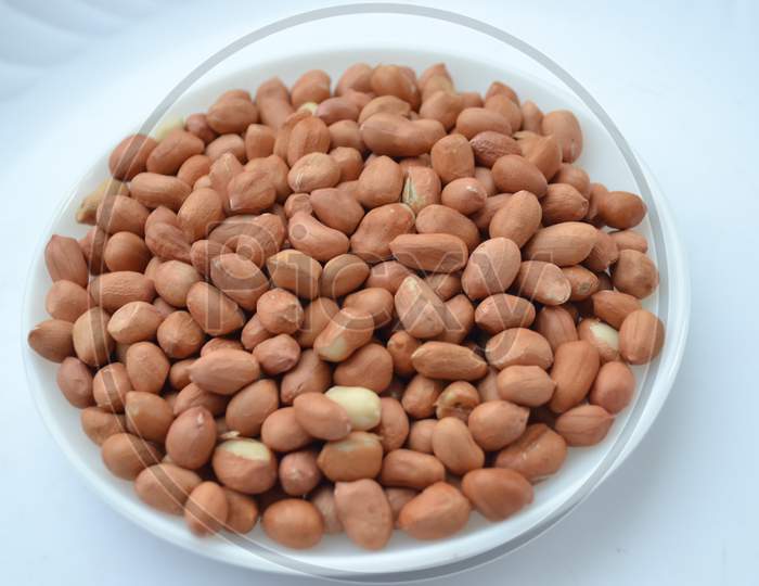 White Plate Which Is Full Of Healthy Pea Nuts