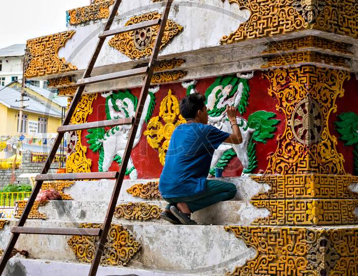Artist Painting With Bright Colours Pagoda In Manali, Himachal Pradesh, India.