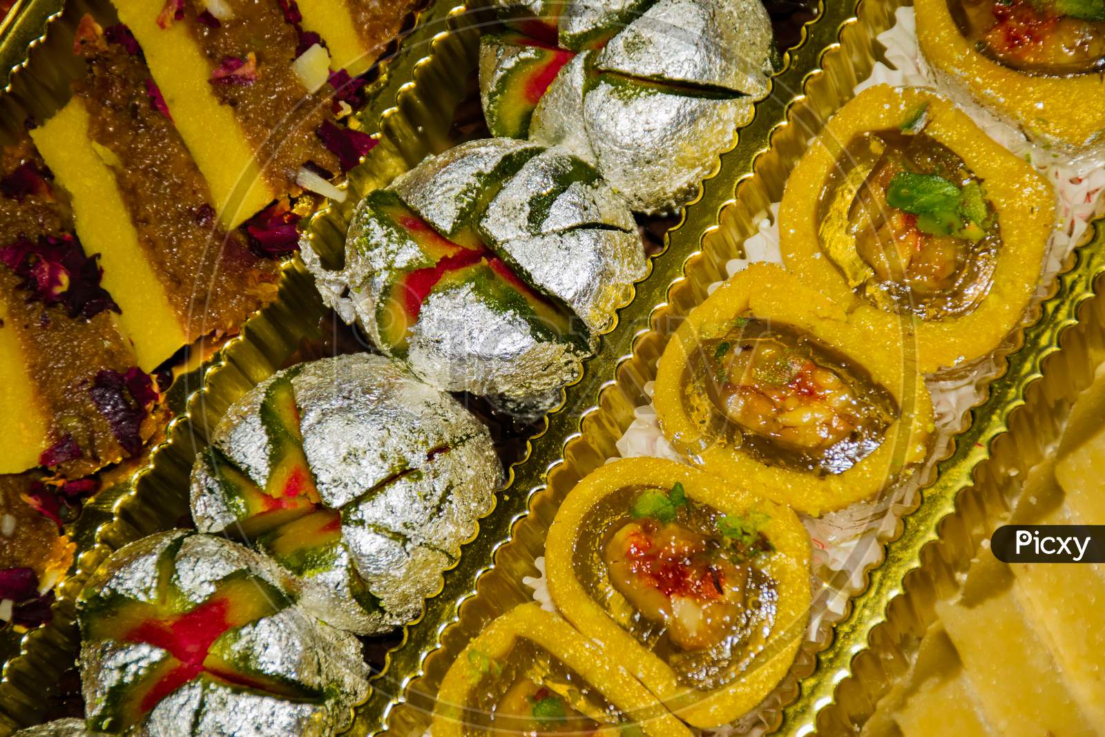 Close up Of A Box Full Of Colourful Indian Desserts For Diwali Festival