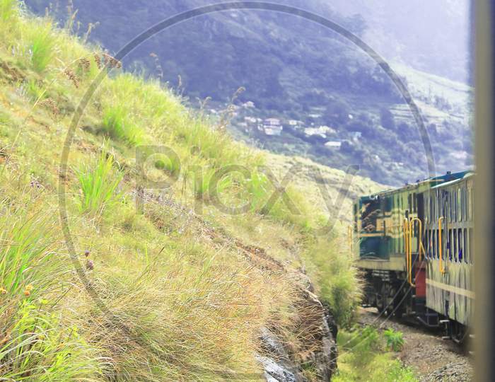 nilgiri mountain rail is going through the green valley of nilgiri mountain range. the railway is one of the best tourist attraction of ooty hill station in tamilnadu, india