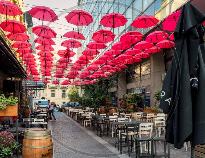 Red Umbrellas Above The Restaurant In Old Bohemian Part Of Belgrade Serbia