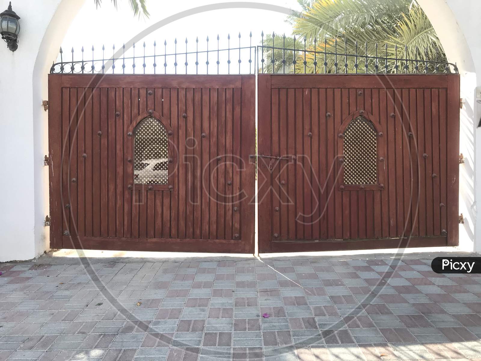 Wooden Shutter With Steel Framed Gate For An Big Villa And Two Openings For Identification Of Personnel