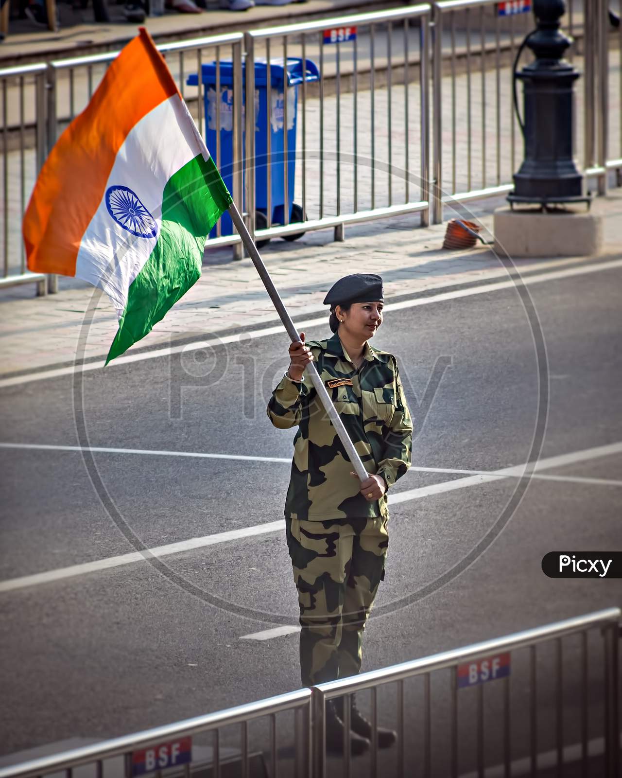 Wagah Border, Punjab, India - April 14Th, 2019 : A Lady Officer Of Indian Border Security Force, Waving Indian National Flag