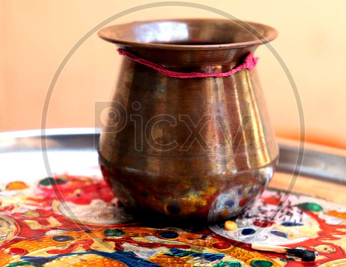 Decorated Copper Vessel In The Plate Of Worship
