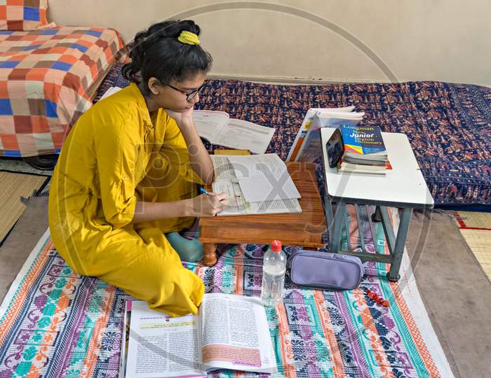 Girl Student Pursuing Online Education Through Cell Phone.