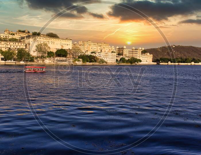 Udaipur, India - May 24, 2013: The Scenic View Of Ambrai Ghat And Lake Pichola Against Dramatic Sunset Located In Rajasthan State