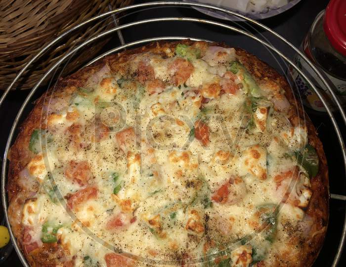 Homemade Yummy And Tasty Cheesy Vegetable Pizza In Lock Down
