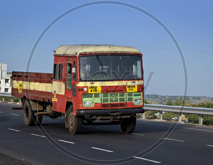 Pune, Maharashtra, India- October 25Th, 2016: State Transport Open Truck Speeding On Highway.
