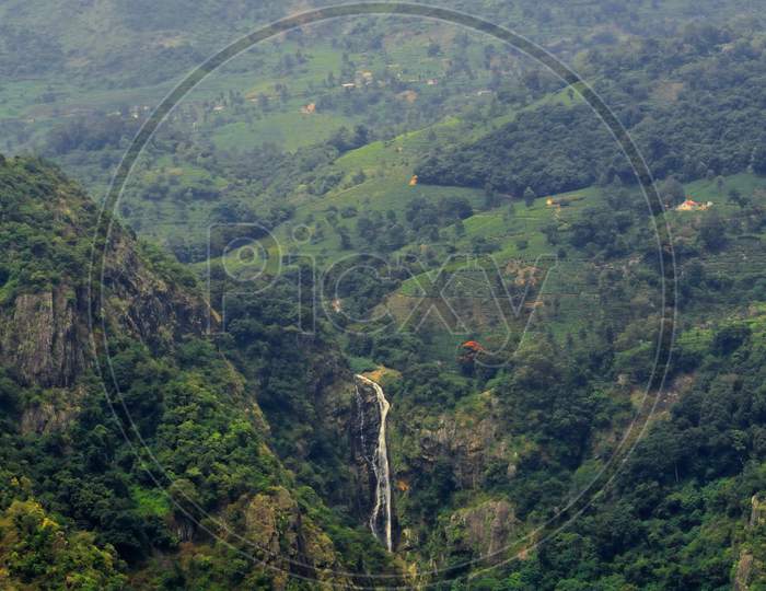 panoramic view of catherine waterfalls from dolphin nose view point at coonoor, near famous ooty hill station. coonoor located at the nilgiri foothills in tamilnadu, south india