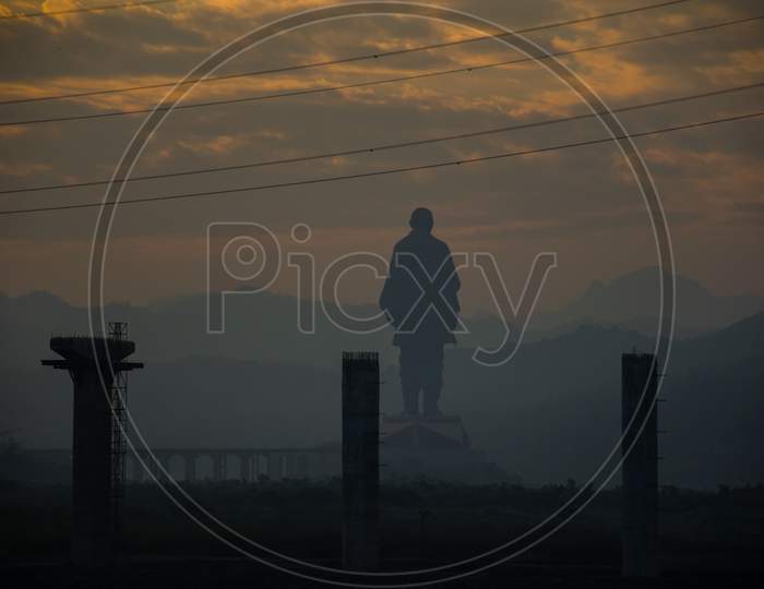 Silhouette Of Statue Of Unity At Sunrise In Gujarat, India