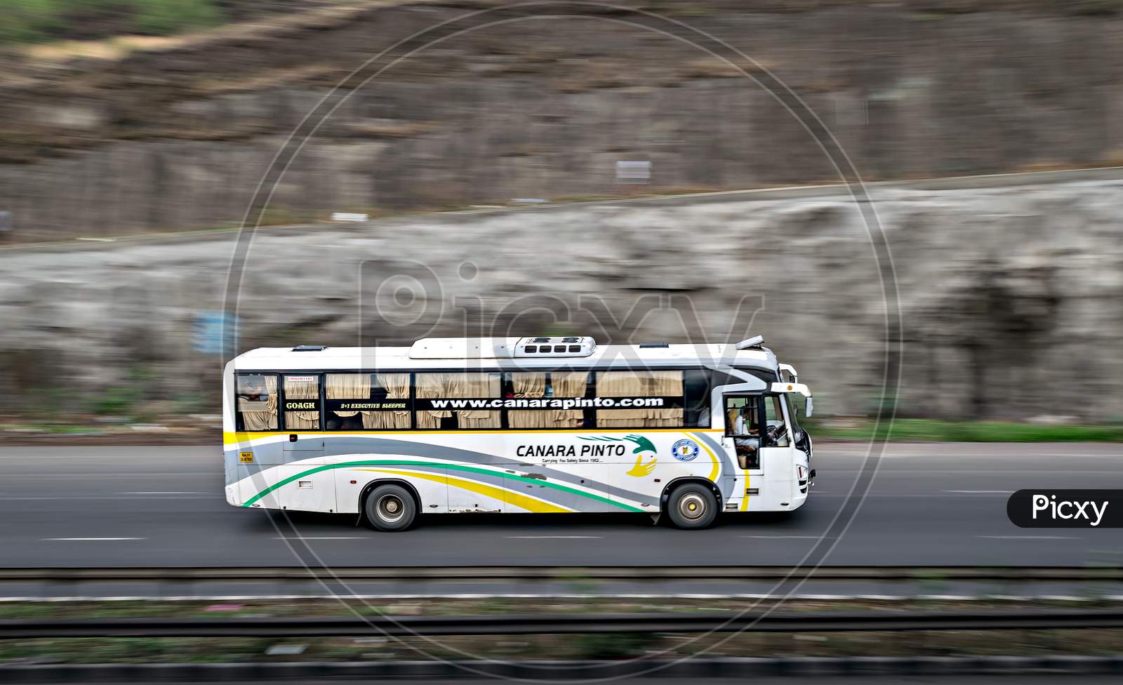 Pune, Maharashtra, India - June 3Rd, 2018 : Blur, Pan Image Of Canara Pinto Travels Bus , Speeding Towards Mumbai On Highway.