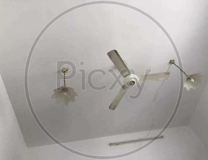 Three Blades Ceiling Fan With Decorative Fans For An Hotel Room During Winter Season Which Is Enough The Climate Cool