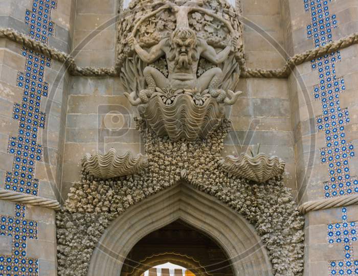 Gargoyle Above The Arched Entrance