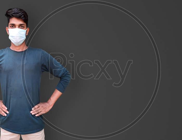 Young Male Model Wearing Face Mask For Corona Virus Isolated Photo