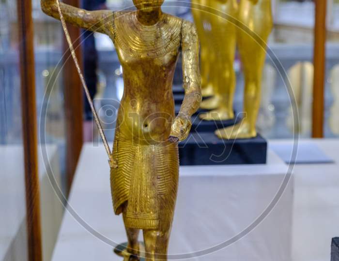Golden Statuettes Depicting Pharaoh In Museum Of Egyptian Antiquities, Egyptian Museum In Cairo, Egypt