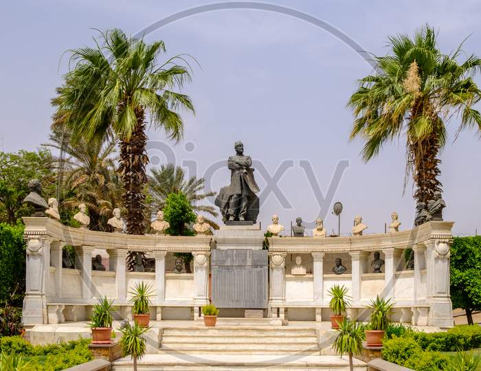 Statue Of Egyptologist Auguste Mariette Pasha In The Courtyard Of The Egyptian Museum In Cairo, Egypt