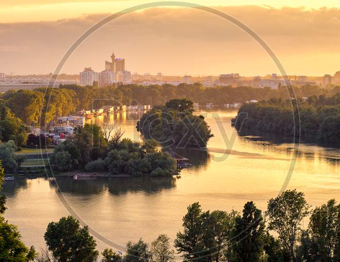 Belgrade Cityscape And Confluence Of Rivers Danube And Sava At Golden Hour