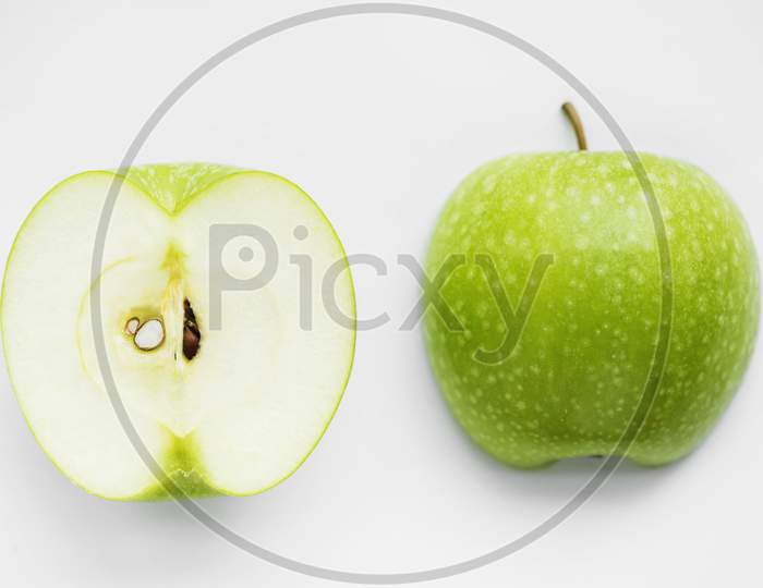 Macro Shot Of Green Apple Isolated On White Background