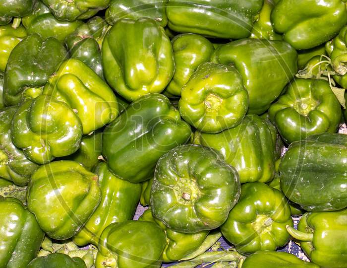Capsicum Or Bell Pepper In An Indian Vegetable Market For Selling, Perfect For Background And Wallpaper