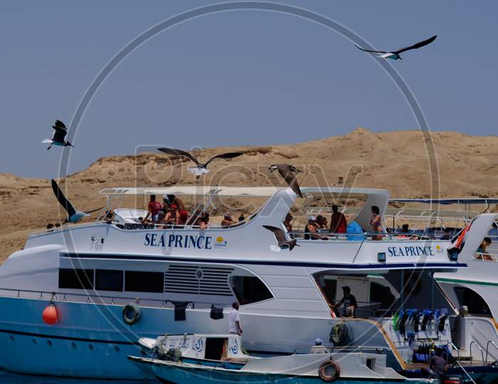 Boats Taking Tourists For Snorkeling And Scuba Diving Near Giftun Island In Red Sea, Hurghada, Egypt