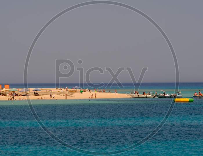 Sandy Beach And Clear Blue Waters Rich In Coral Reefs Of Giftun Island Near Hurghada, Red Sea Coast, Egypt