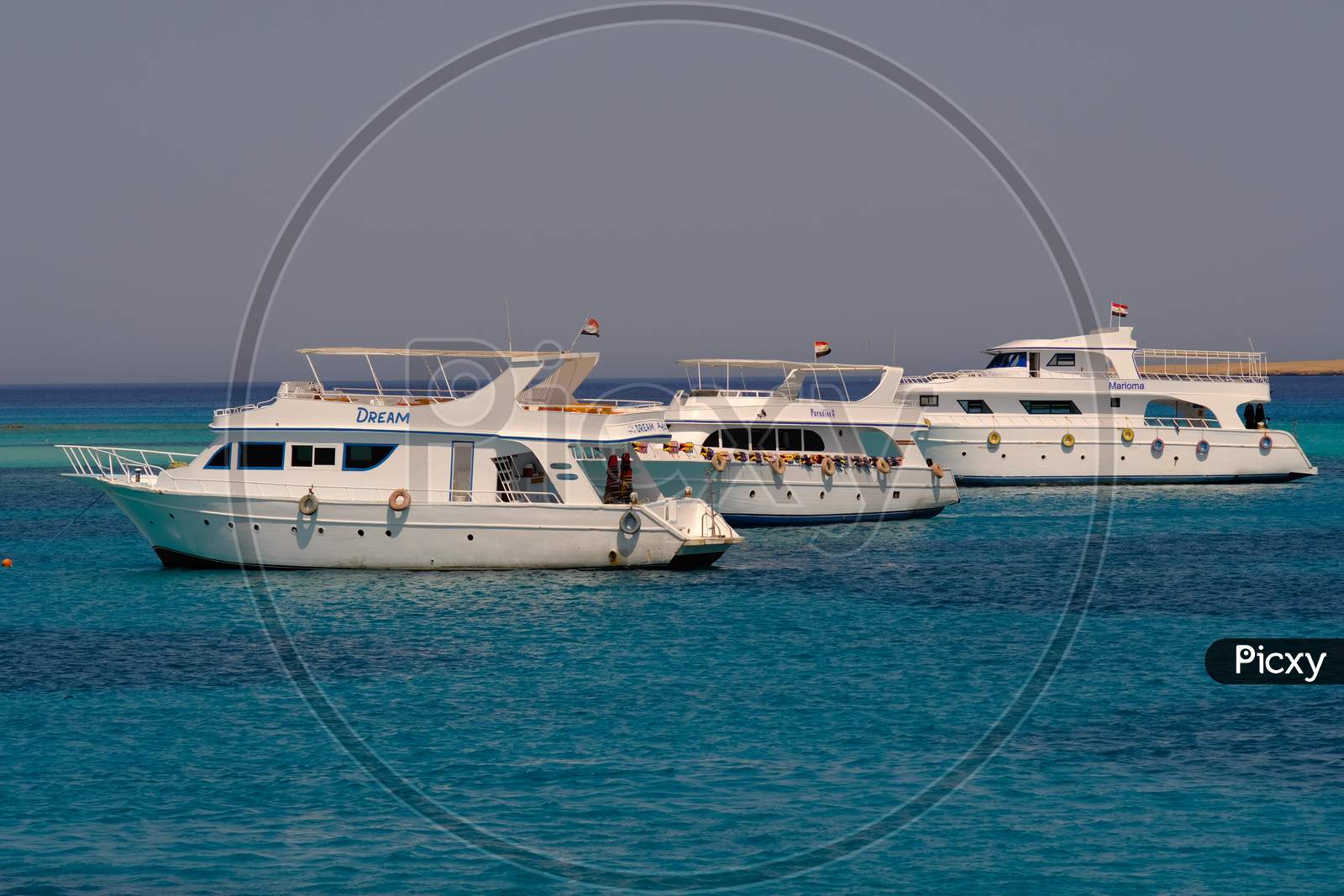 Boats Taking Tourists For Snorkeling And Scuba Diving Near Giftun Island In Red Sea, Hurghada, Egypt