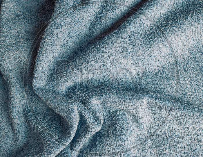 Top View Of A Light Blue Towel With Some Wrinkles