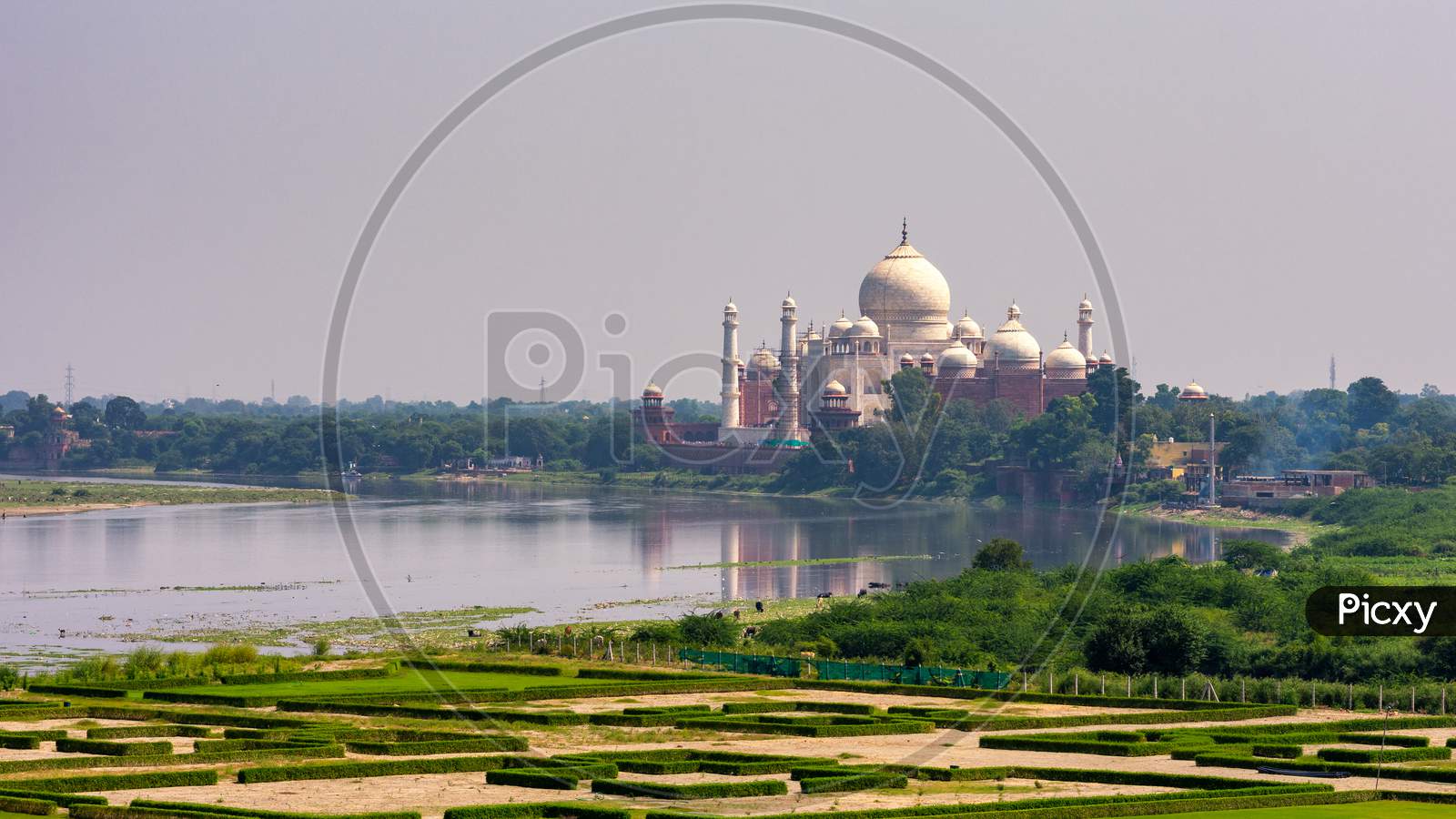 Distant View Of The Taj Mahal Mausoleum Next To The Yamuna River In, Agra, India