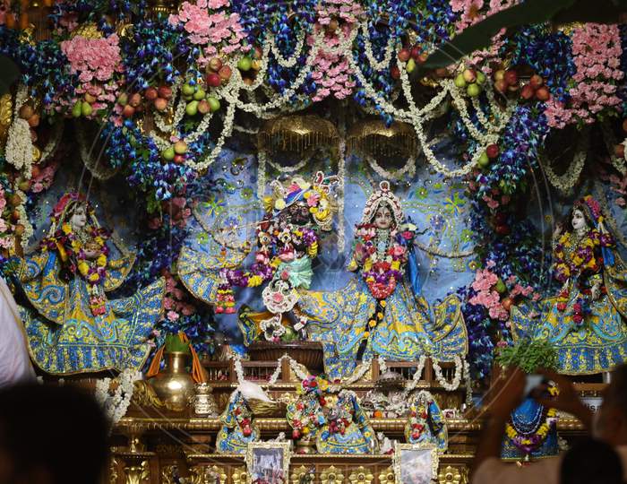 A Priest Performs 'Aarti' Of Radha - Krishna On The Occasion Of Sri Krishna Janmashtami At ISKCON Temple In New Delhi On August 12, 2020.