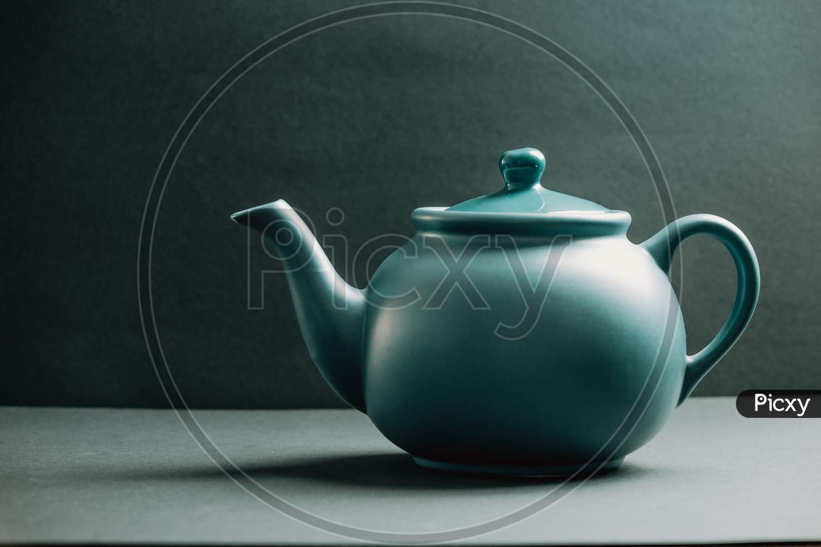 Blue Vintage Teapot Over A Dark Background