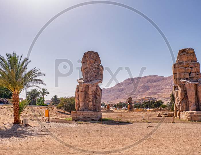 Colossi Of Memnon, Massive Stone Statues Of The Pharaoh Amenhotep Iii In Luxor, Egypt.
