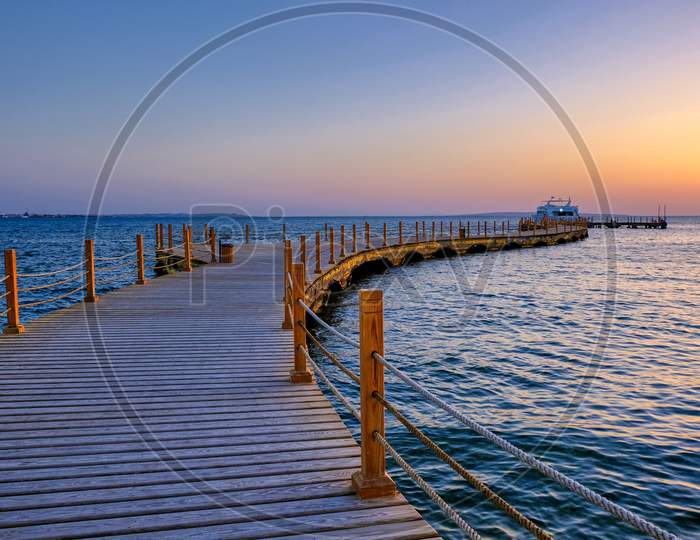 View Of The Promenade Boardwalk Over The Red Sea During Sunrise In Hurghada, Egypt