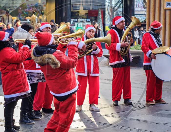 Brass Trumpet Band Musicians Dressed In Santa Claus Costumes In Belgrade, Serbia