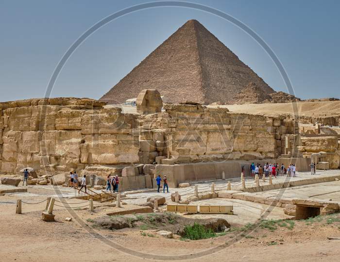 Tourists Visiting The Giza Plateau With The Great Sphinx And The Giza Pyramid Complex In Cairo, Egypt
