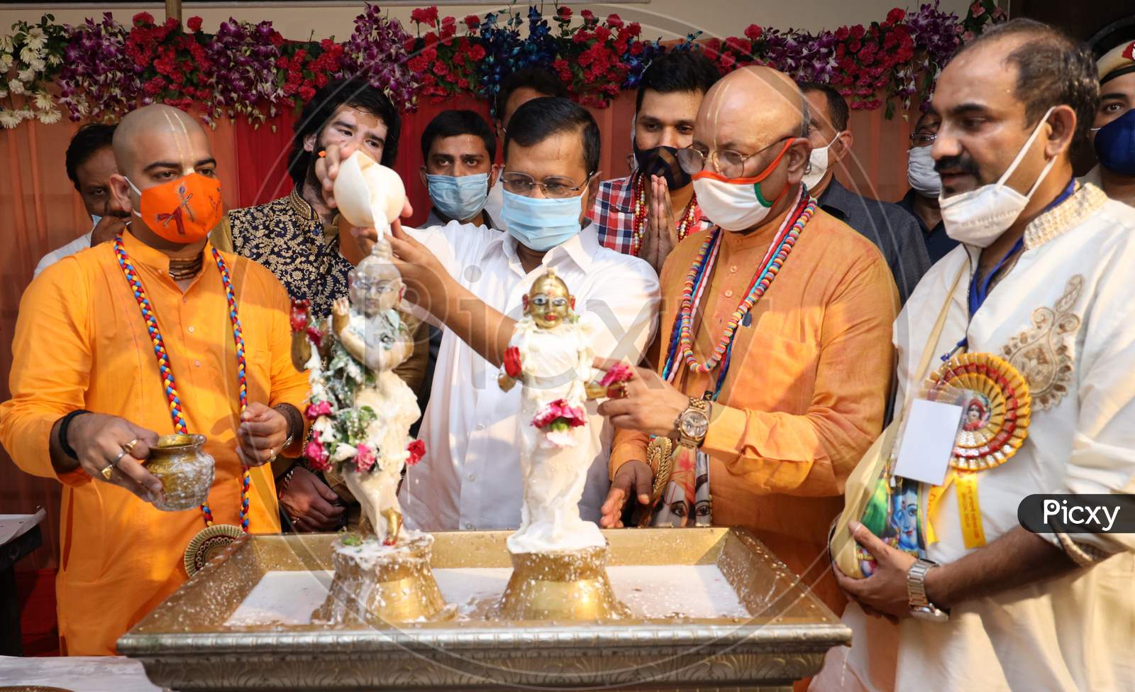 Delhi Chief Minister Arvind Kejriwal Pours Milk Onto The Idol Of Hindu Lord Krishna On The Occasion Of The 'Janmashtami' Festival, Marking Krishna's Birth, At ISKCON Temple In New Delhi On August 12, 2020.