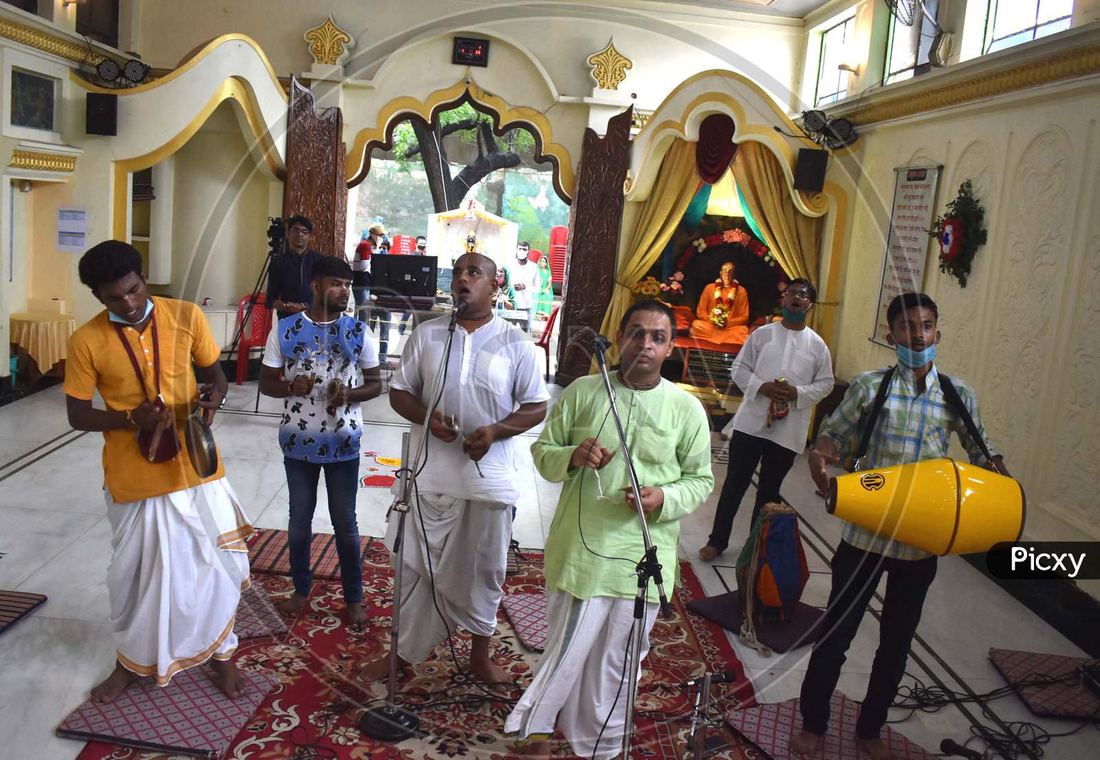 Hindu devotees offer prayers to Lord Krishna and Radha on the occasion of Krishna Janmashtami festival at ISKCON temple  in Prayagraj, August 12, 2020.