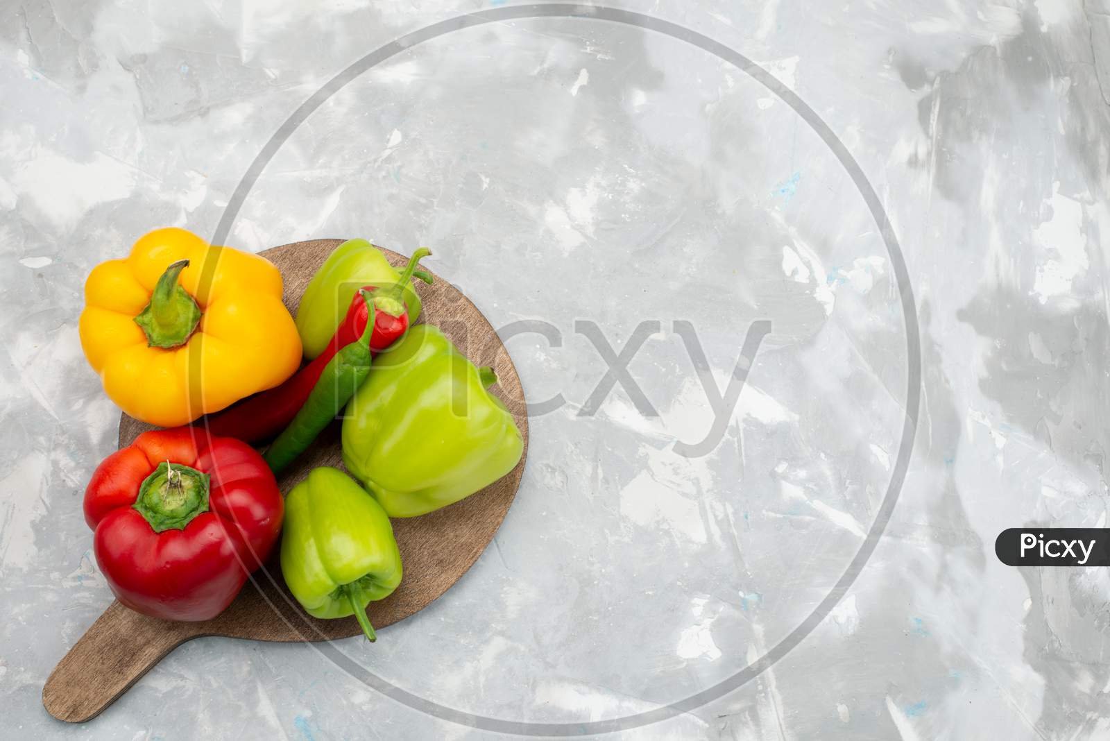 image-of-top-view-colorful-peppers-with-bell-peppers-on-the-light-desk