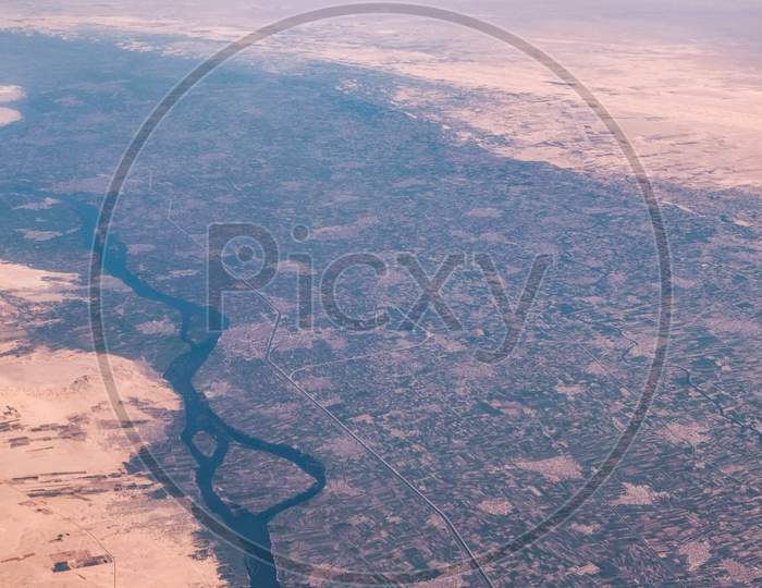 Aerial Airplane View Of Nile River Valley And The Surrounding Sahara Desert In Egypt