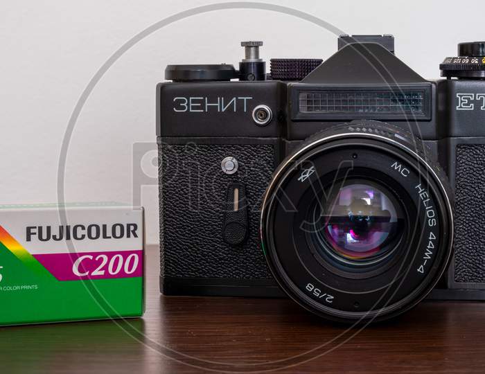 Soviet Analog Film Camera Zenit Et, With A Pack Of Fujifilm Fujicolor C200 Film