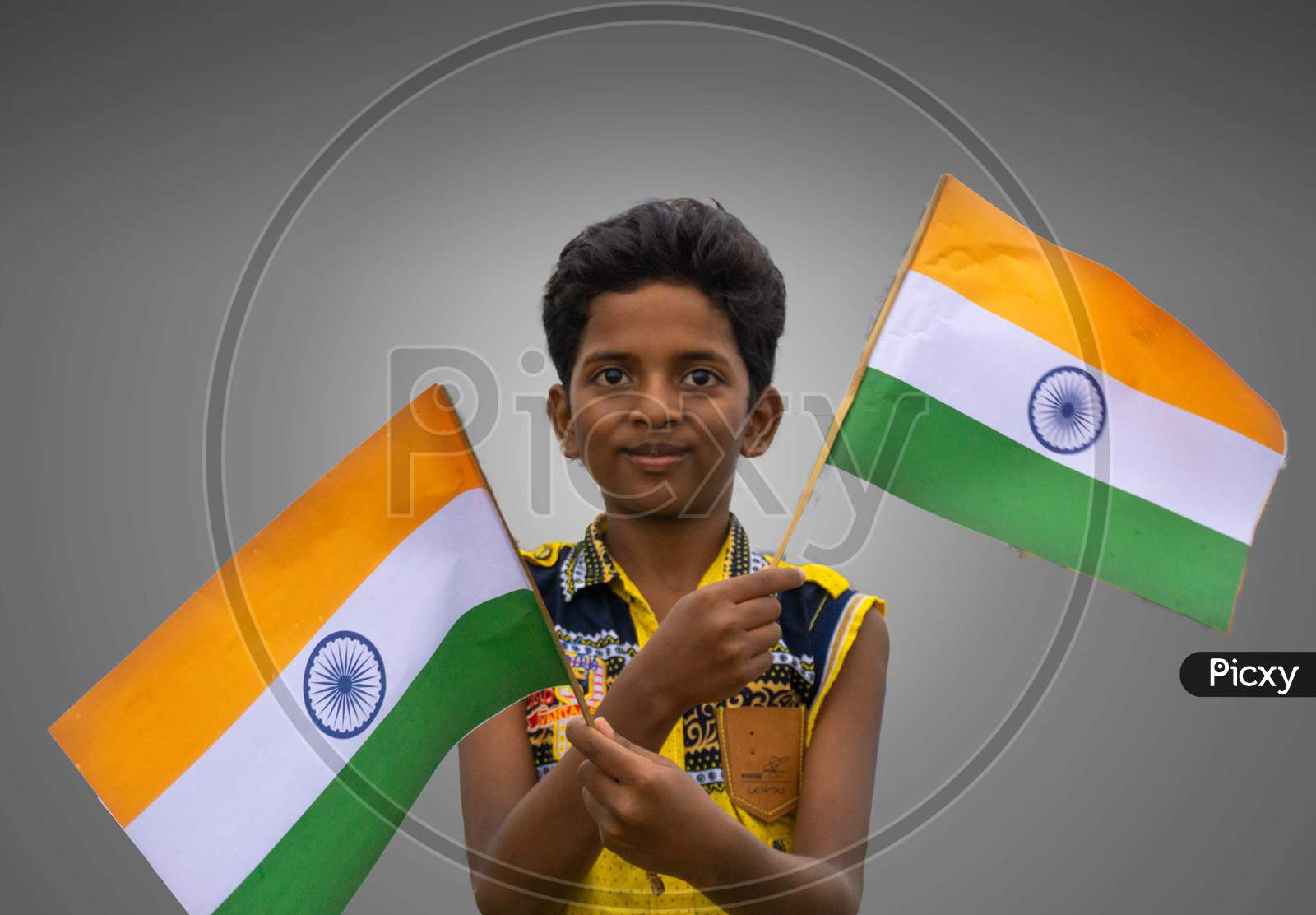 KID WEARING MASK AND HOLDING INDIAN FLAG