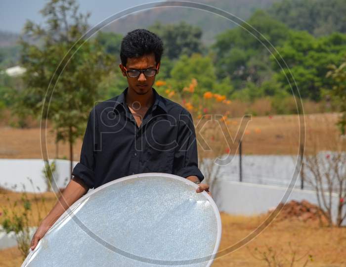 Young Smart Man With Reflector
