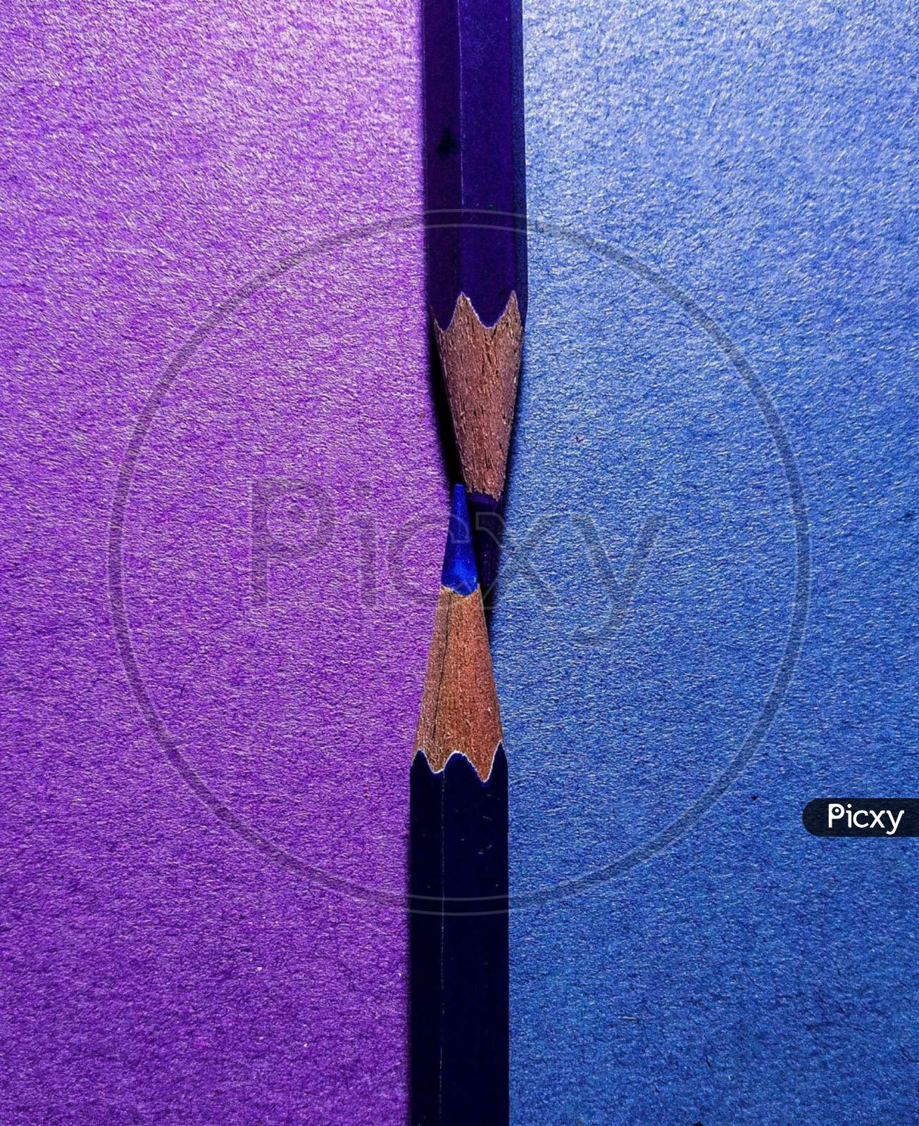 Colour pencils blue and purple background