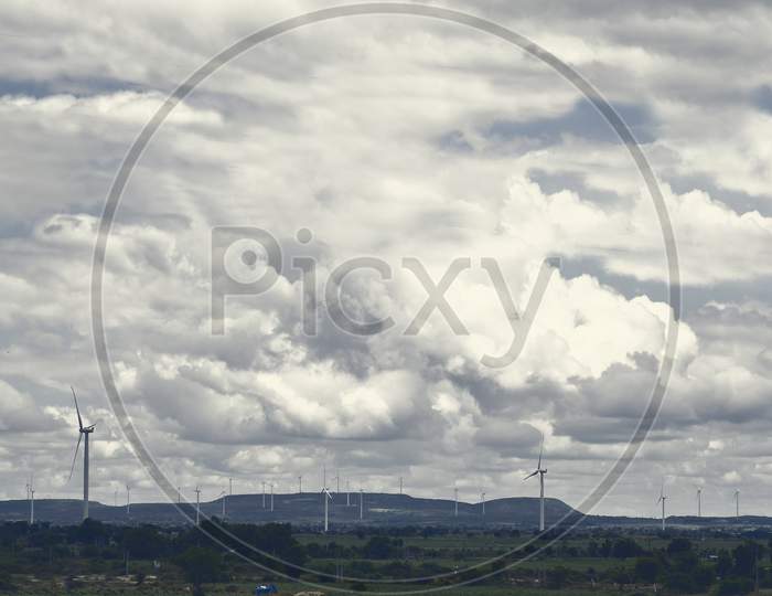 Wind Farm With Turbine, Clouds, Mountain Stock Images .