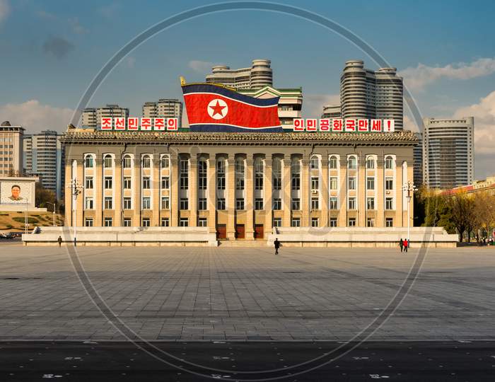 Kim Il-Sung Square And Government Building Decorated With Huge Flag Of North Korea