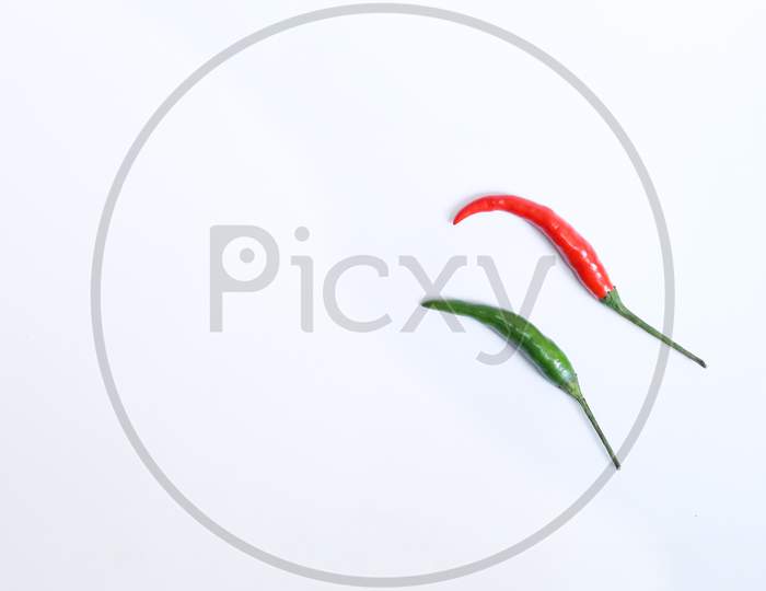 Red with green chilli in a white background