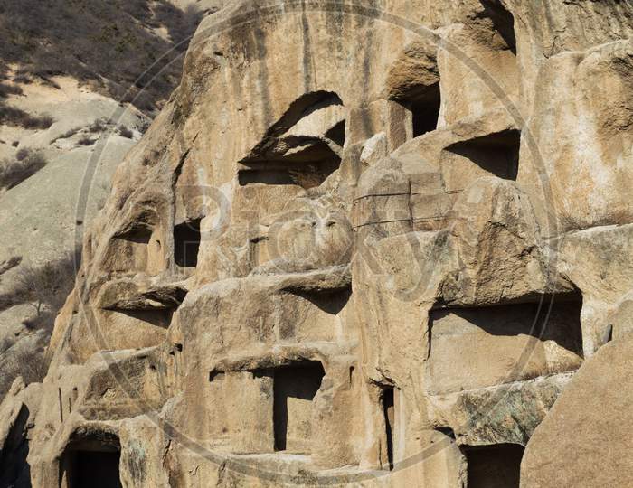 Ancient Cliff Dwellings Of Guyaju Caves In China
