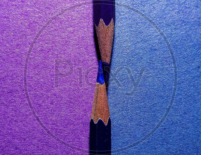 Colour pencils blue and purple background